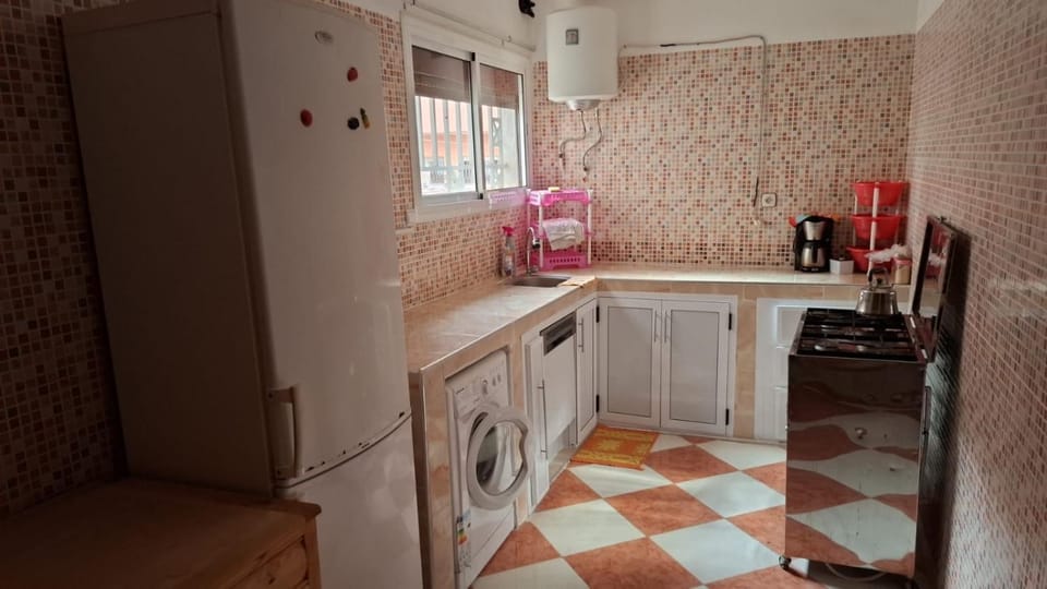 Kitchen or kitchenette, stove, washing machine