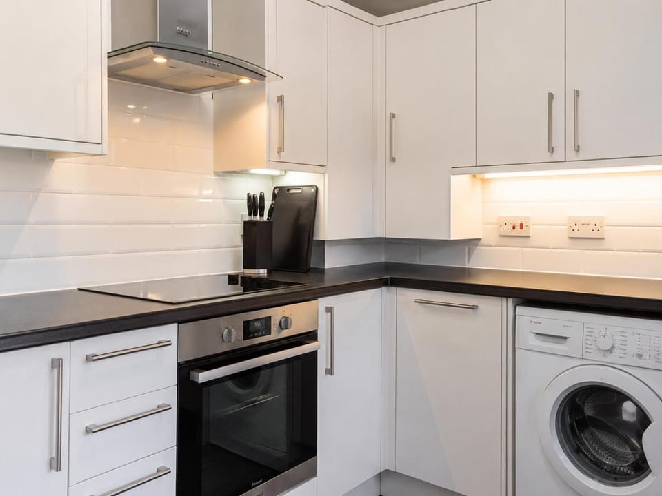 Kitchen or kitchenette, oven, stove, washing machine, kitchen