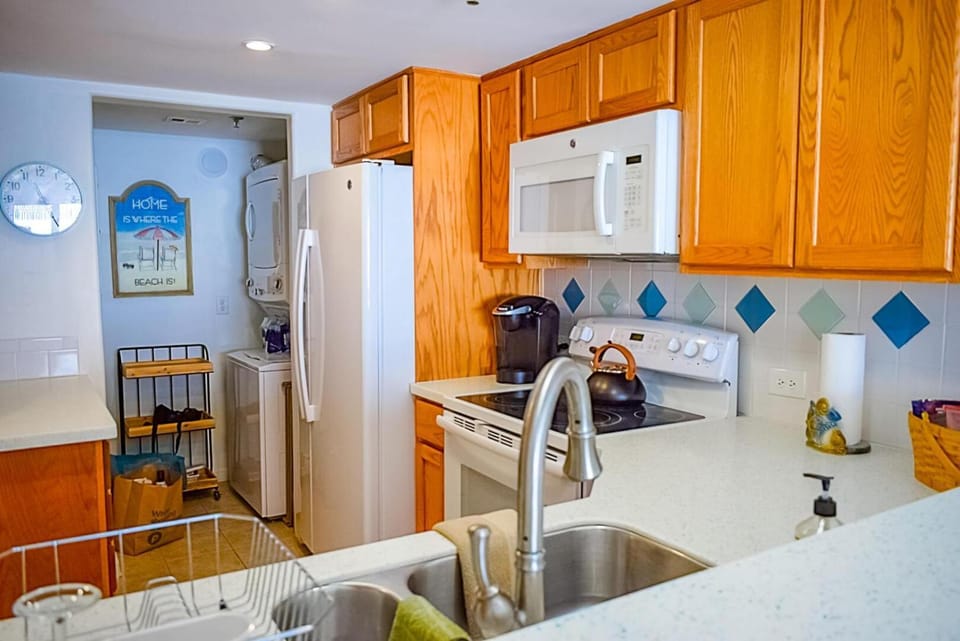 Kitchen or kitchenette, dishwasher, oven, stove, toaster