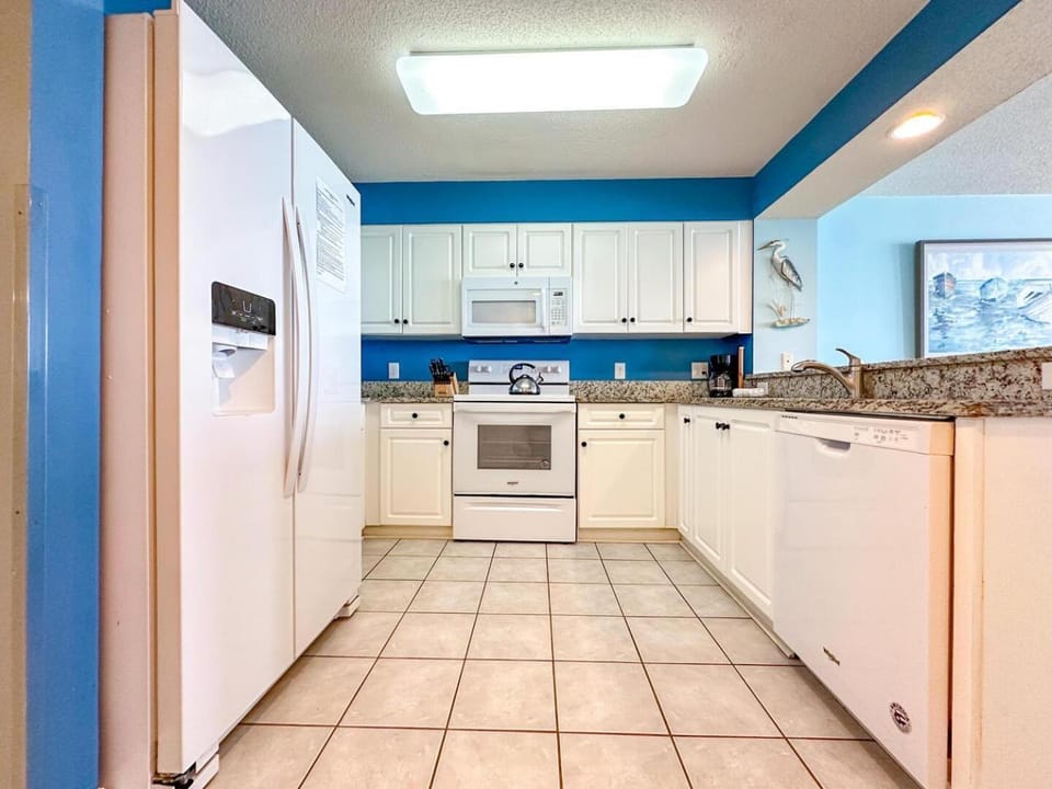 Kitchen or kitchenette, dishwasher, oven, stove