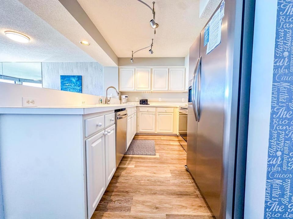 Kitchen or kitchenette, dishwasher, oven, stove