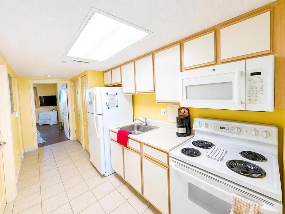 Kitchen or kitchenette, dishwasher, oven, stove