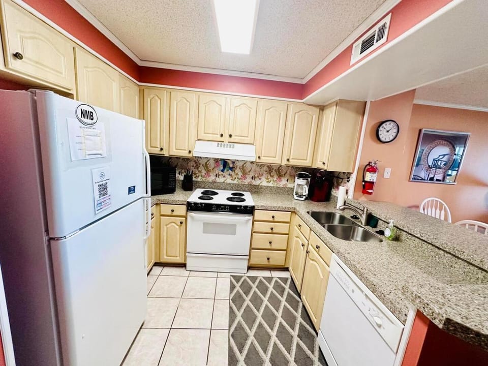 Kitchen or kitchenette, dishwasher, oven, stove, toaster