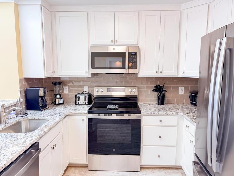Kitchen or kitchenette, dishwasher, oven, stove, toaster