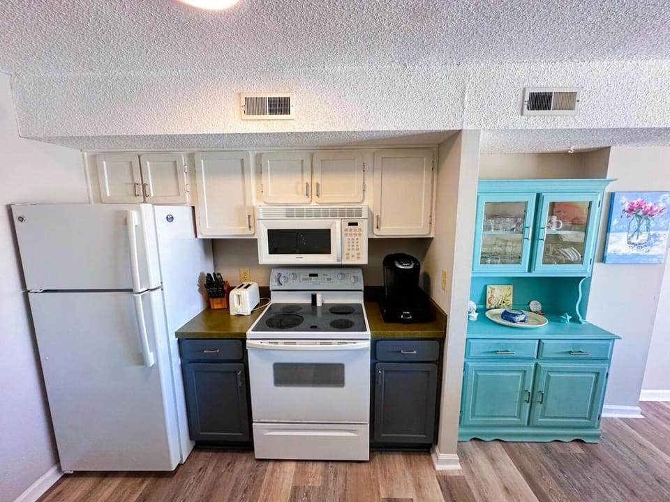 Kitchen or kitchenette, dishwasher, oven, stove, toaster