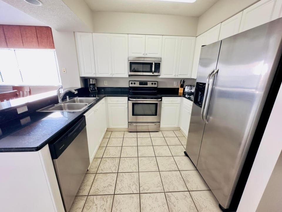 Kitchen or kitchenette, dishwasher, oven, stove, toaster