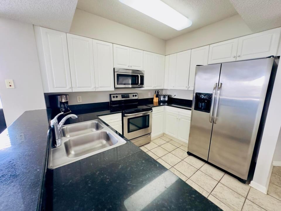 Kitchen or kitchenette, dishwasher, oven, stove, toaster