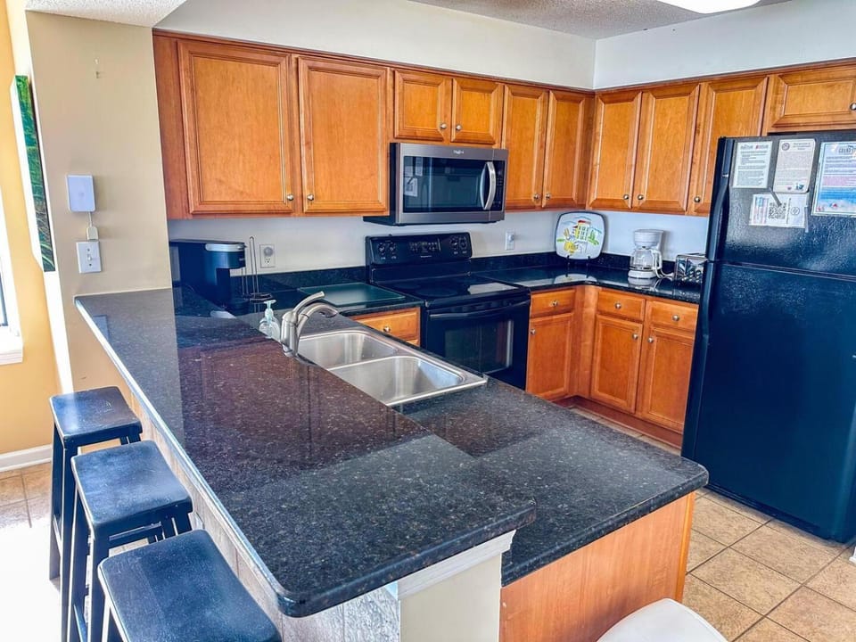 Kitchen or kitchenette, dishwasher, oven, stove
