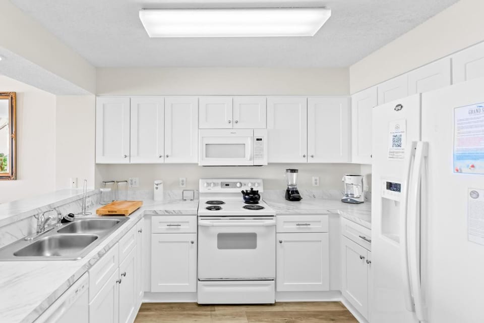 Kitchen or kitchenette, dishwasher, oven, stove, toaster