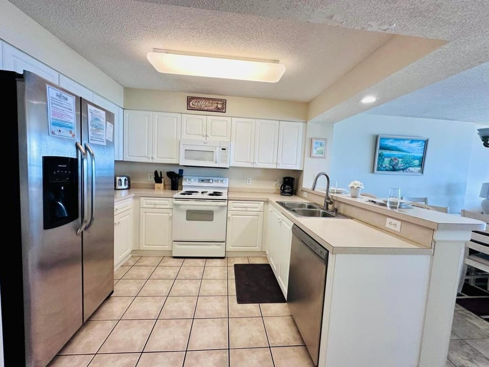 Kitchen or kitchenette, dishwasher, oven, stove, toaster