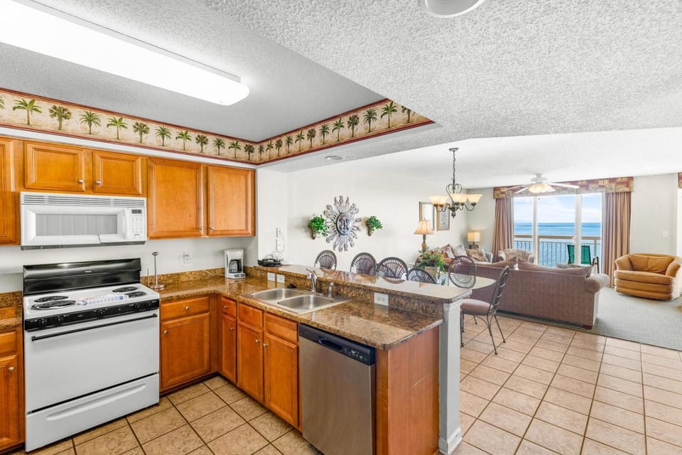 Kitchen or kitchenette, Living room, Seating area, Dining area, dishwasher, oven, stove, toaster