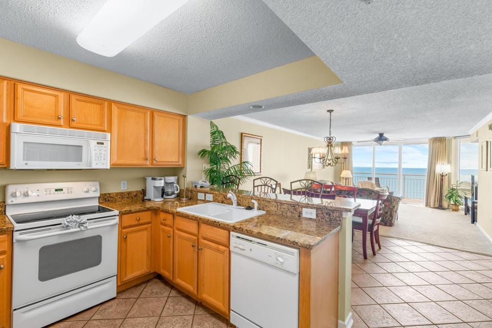 Kitchen or kitchenette, dishwasher, oven, stove, toaster