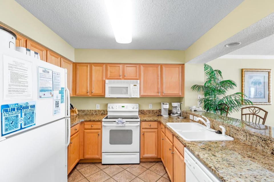 Kitchen or kitchenette, dishwasher, oven, stove, toaster
