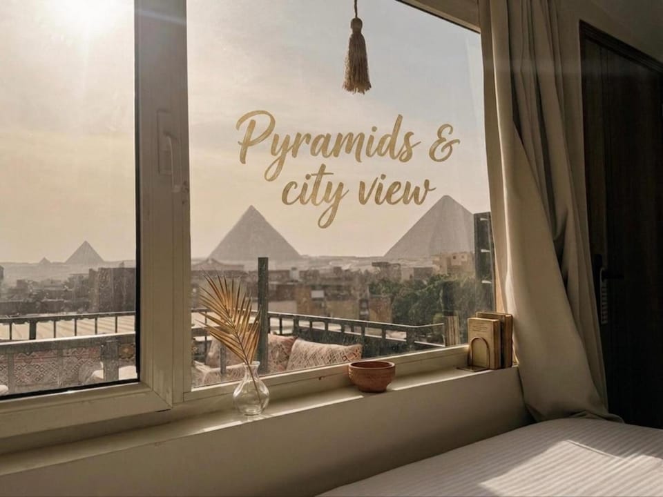 Nearby landmark, Bed, Day, Natural landscape, View (from property/room), Balcony/Terrace, Photo of the whole room, Bedroom, Text overlay, City view, Mountain view