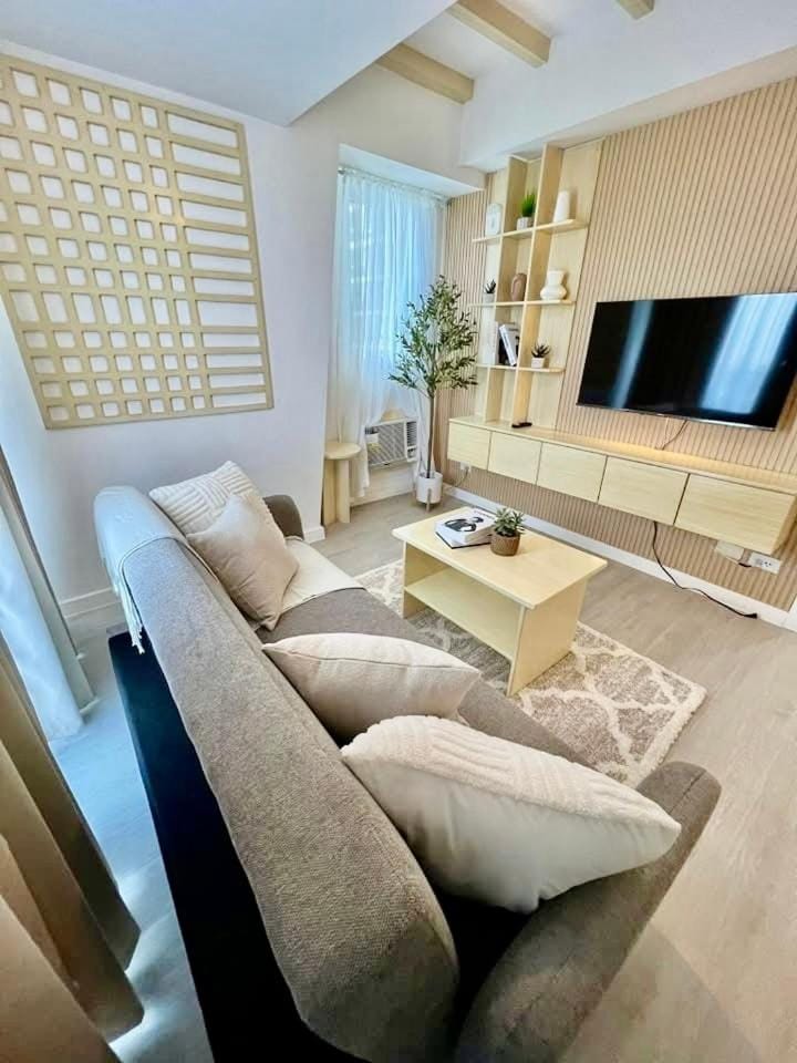 1 Bedroom NAMI Suite Japandi-Inspired by THE BALI CORNER AT AZURE NORTH, CORNER UNIT with BIG Balcony and Amazing FULL view of the Beach Resort Amenities Apartment in Calabarzon