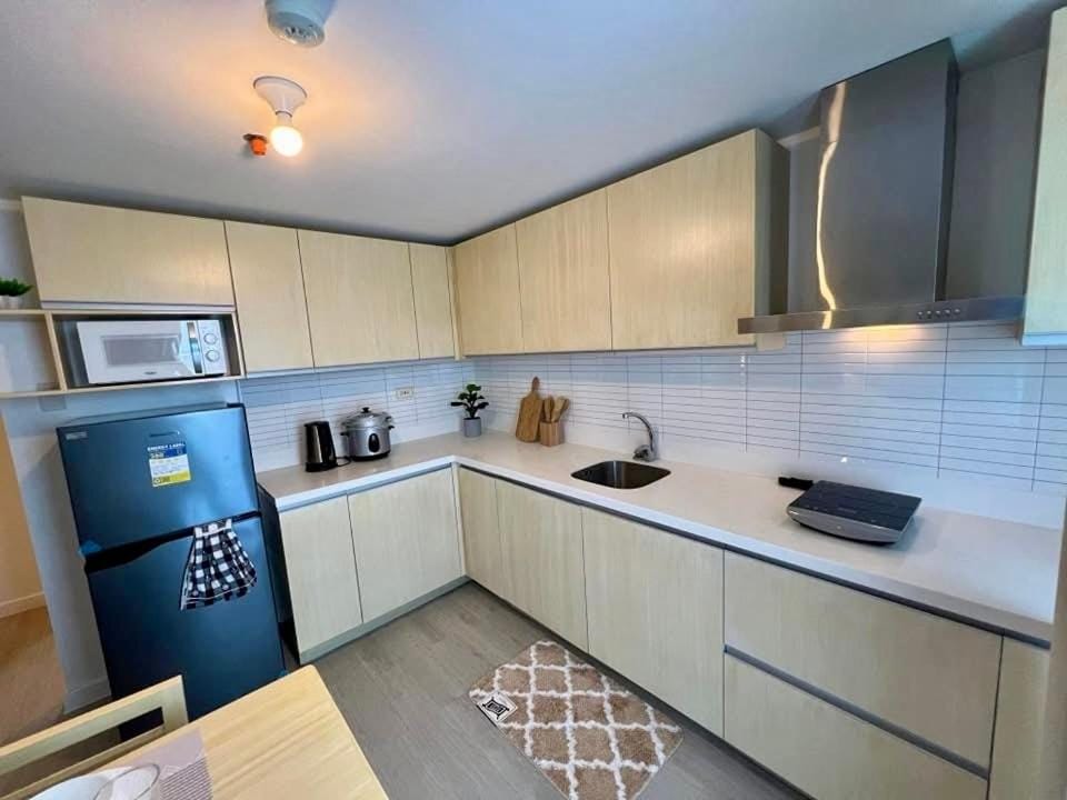 1 Bedroom NAMI Suite Japandi-Inspired by THE BALI CORNER AT AZURE NORTH, CORNER UNIT with BIG Balcony and Amazing FULL view of the Beach Resort Amenities Apartment in Calabarzon
