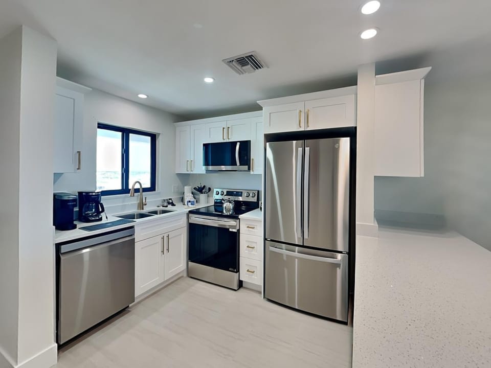 Kitchen or kitchenette, dishwasher, microwave, oven, stove, kitchen
