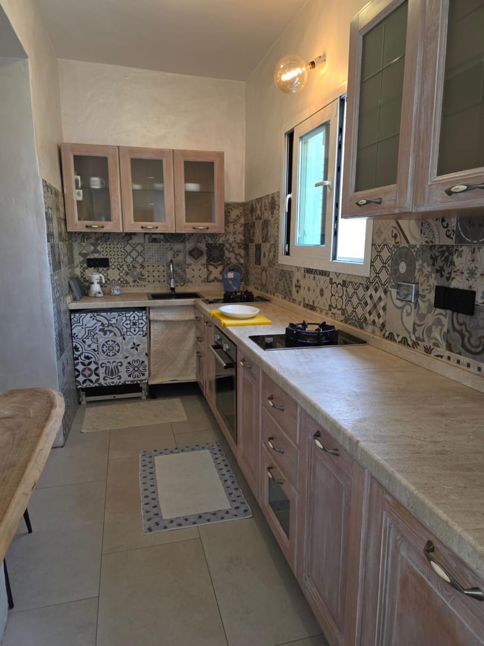 Kitchen or kitchenette, dishwasher, oven, stove