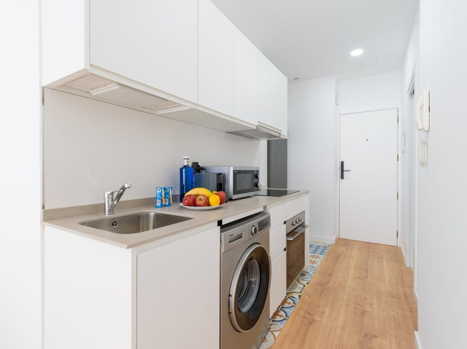 Kitchen or kitchenette, oven, stove, washing machine