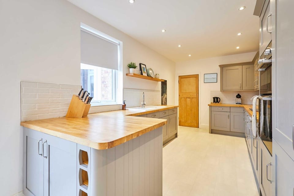 Kitchen or kitchenette, dishwasher, oven, stove