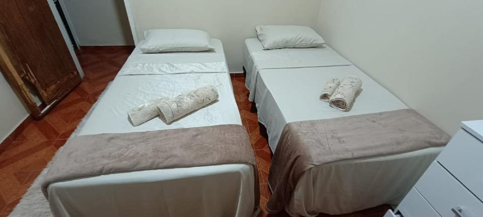 Shower, Bed, towels, wardrobe