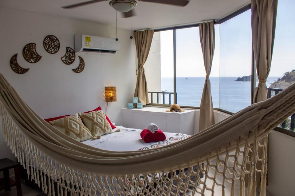 Bed, Natural landscape, Living room, Photo of the whole room, Seating area, Sea view, fireplace, towels