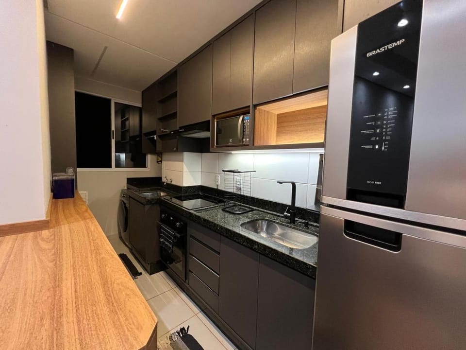 Kitchen or kitchenette, dishwasher, oven, stove