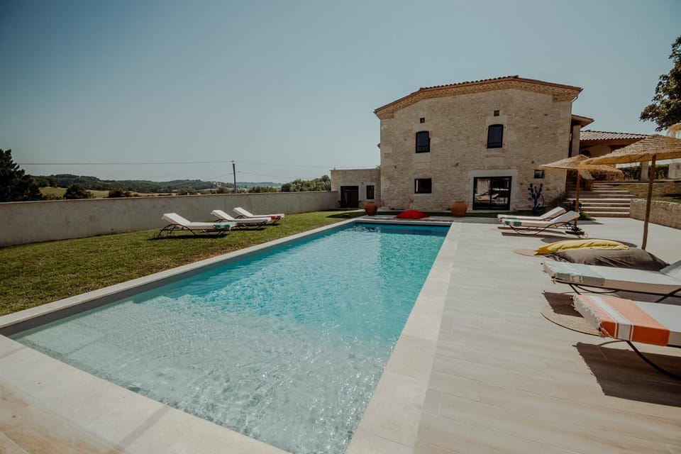 Property building, Patio, Day, Natural landscape, Pool view, Swimming pool, Swimming pool, sunbed
