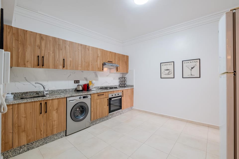 Kitchen or kitchenette, oven, stove, washing machine