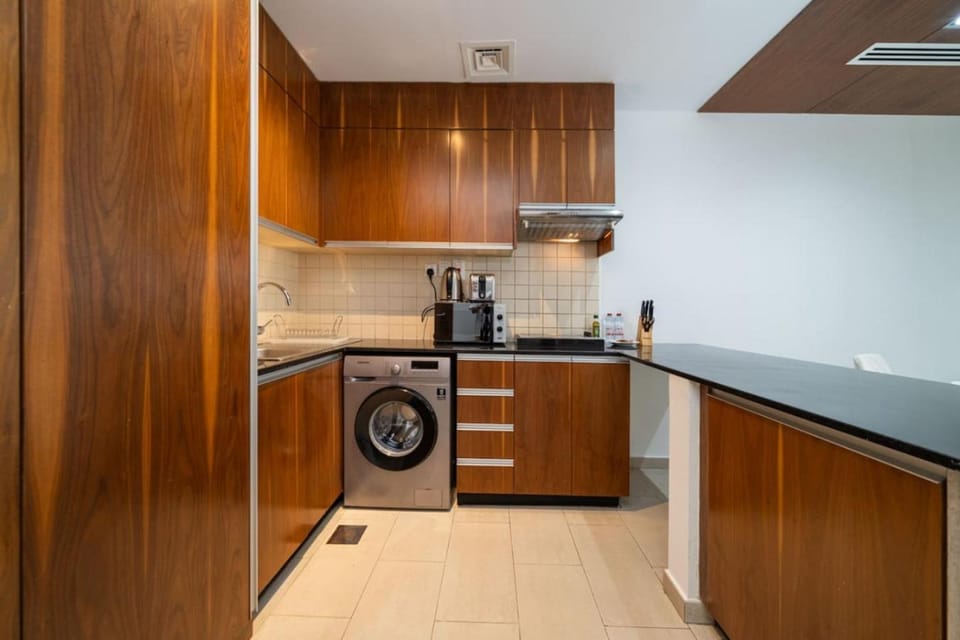 Kitchen or kitchenette, stove, toaster, washing machine