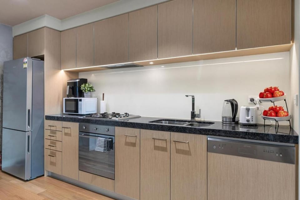 Kitchen or kitchenette, dishwasher, oven, stove, toaster