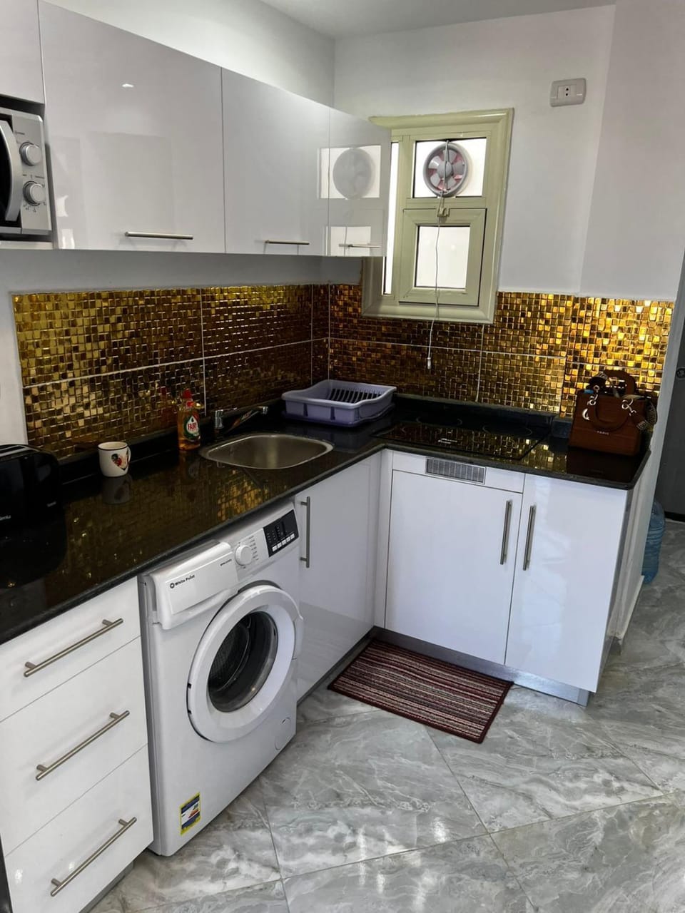 Kitchen or kitchenette, stove, washing machine