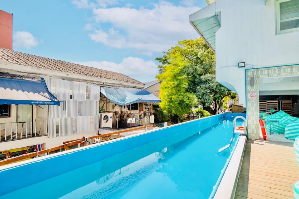 Property building, Day, Pool view, Swimming pool, sunbed