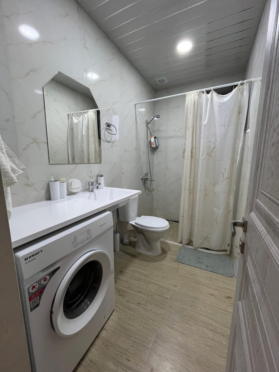 Shower, Toilet, towels, washing machine