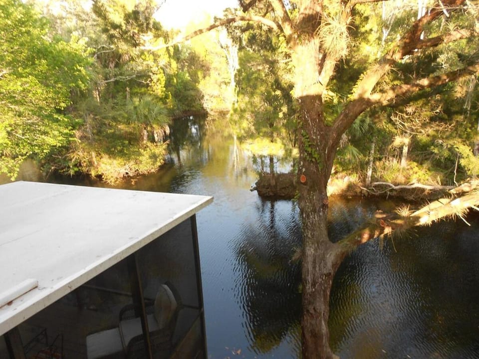 Large Waterfront canal home W Kayaks and covered boathouse House in Florida