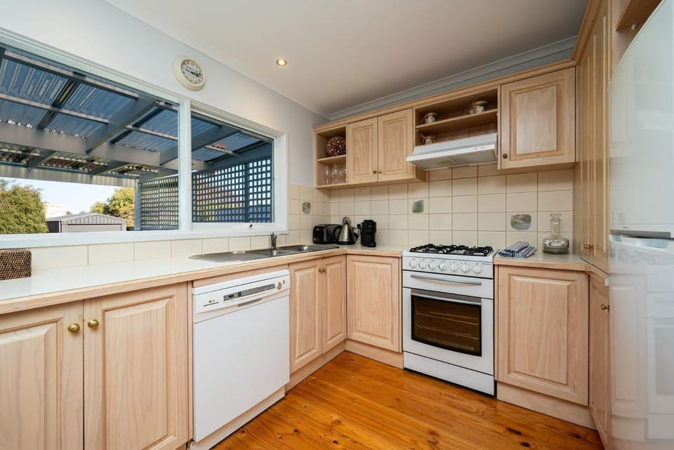 Kitchen or kitchenette, dishwasher, oven, stove, toaster