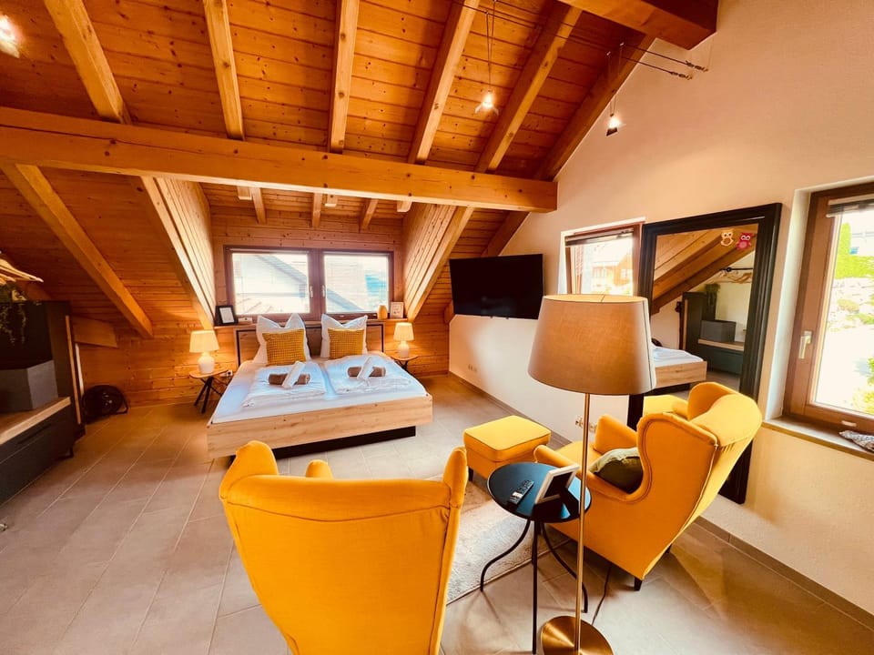 Bed, TV and multimedia, Living room, Seating area, Bedroom
