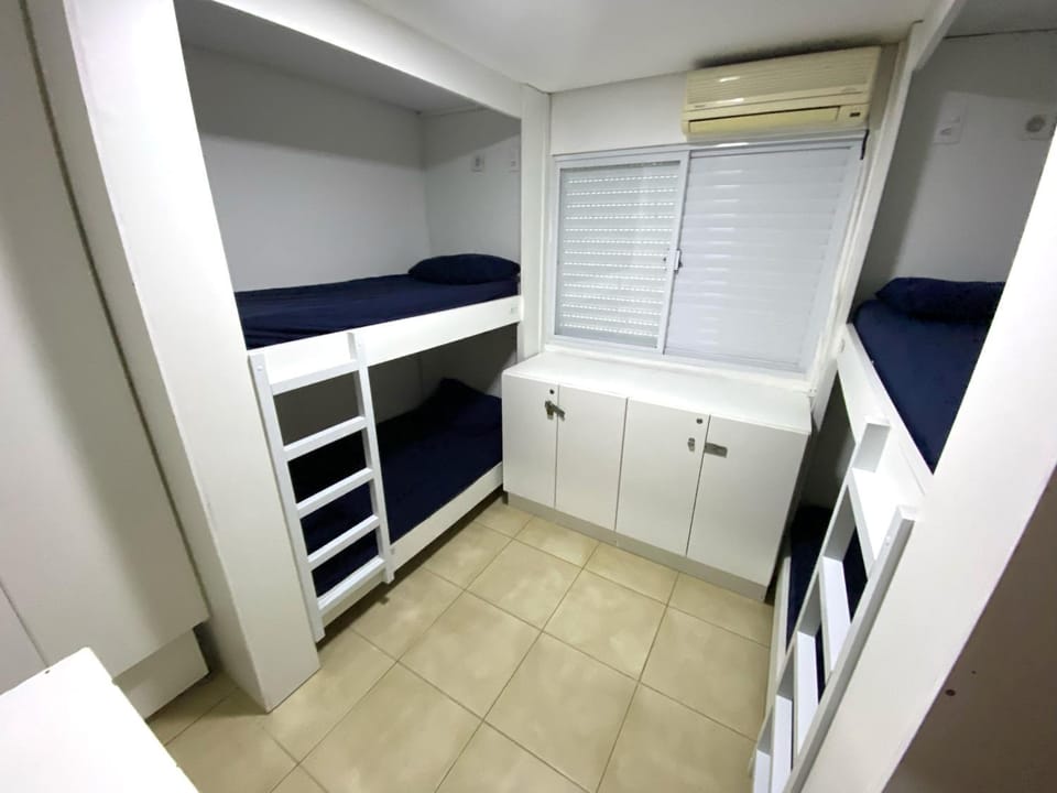 Photo of the whole room, bunk bed, wardrobe, air conditioner