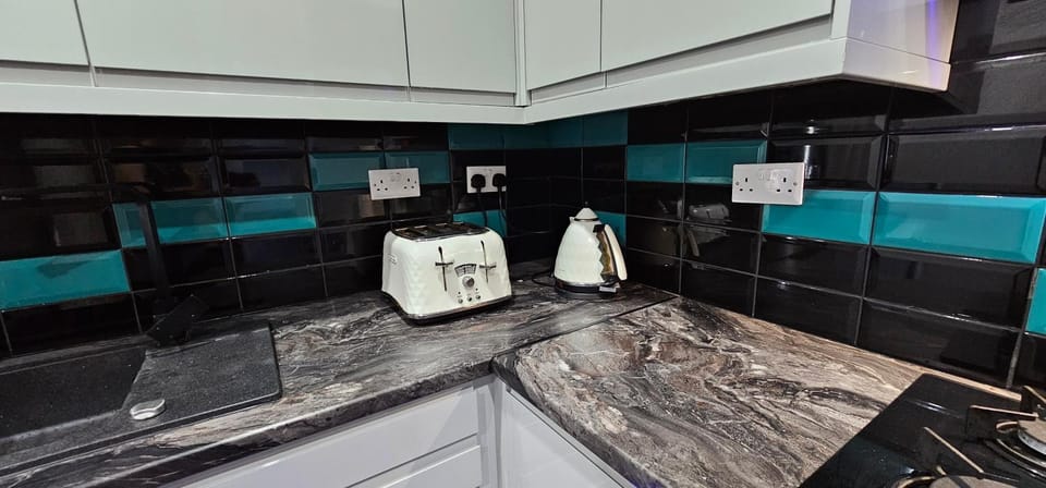 Blue Light Kitchen Apartment in Cardiff