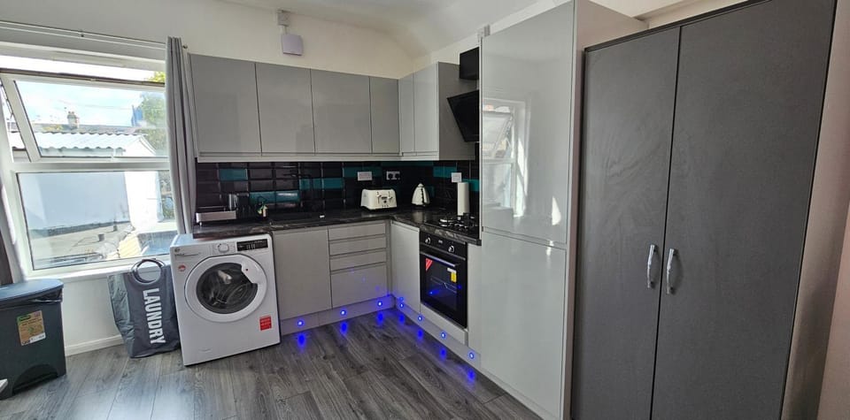 Blue Light Kitchen Apartment in Cardiff