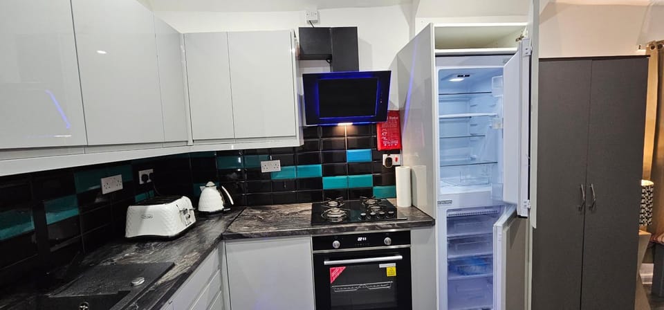 Blue Light Kitchen Apartment in Cardiff