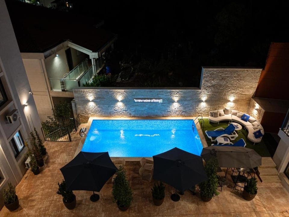 Patio, Night, Pool view, Swimming pool, sunbed