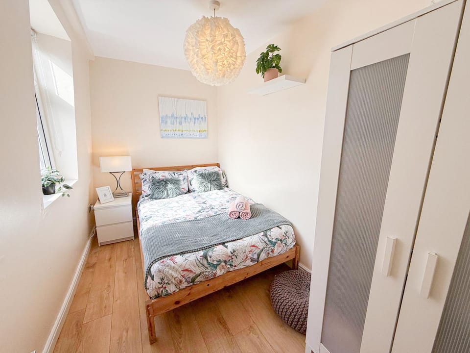 Bed, Photo of the whole room, Decorative detail, Bedroom, flat iron, hair dryier, heating, storage, towels, wardrobe
