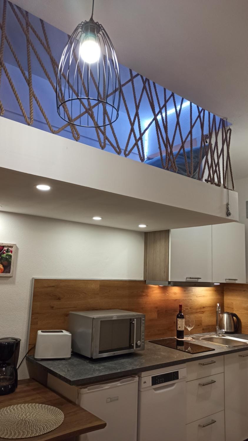 Kitchen or kitchenette, bunk bed, dishwasher, stove, toaster