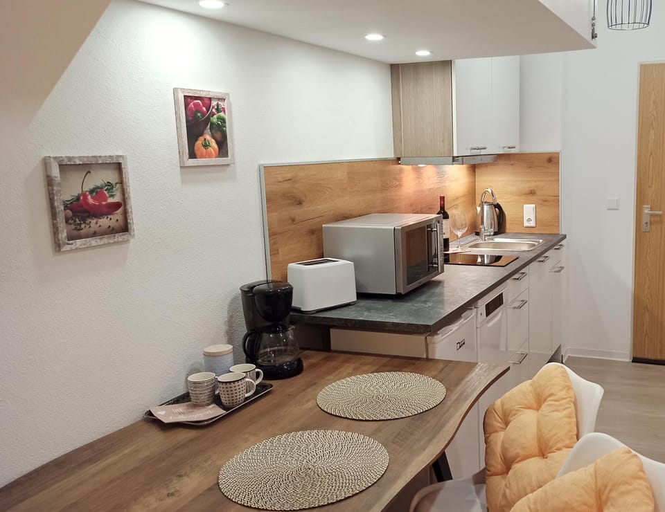 Kitchen or kitchenette, Dining area, microwave, stove, toaster