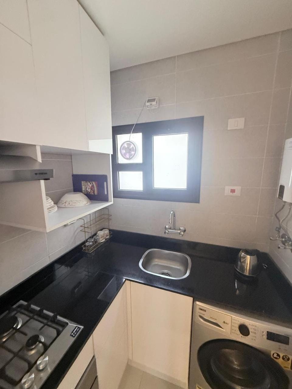 Kitchen or kitchenette, washing machine