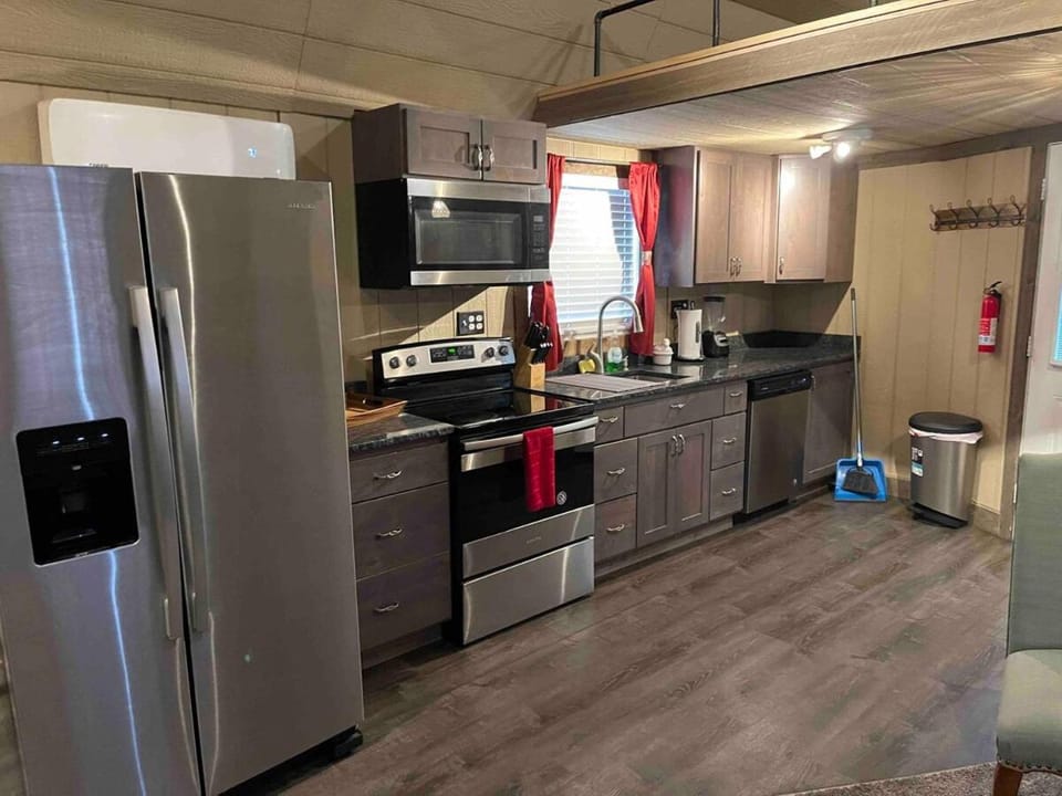 Kitchen or kitchenette, dishwasher, oven, stove, toaster
