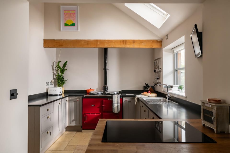 Kitchen or kitchenette, dishwasher, stove, toaster