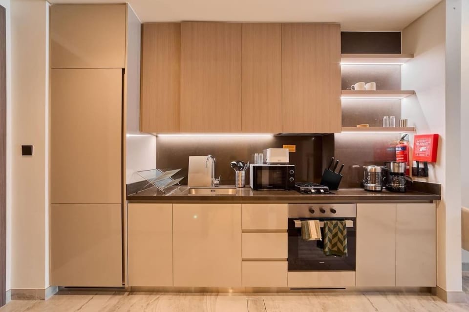 FAM Living Dubai Escape Sleek Studio at Peninsula Five Apartment in Dubai