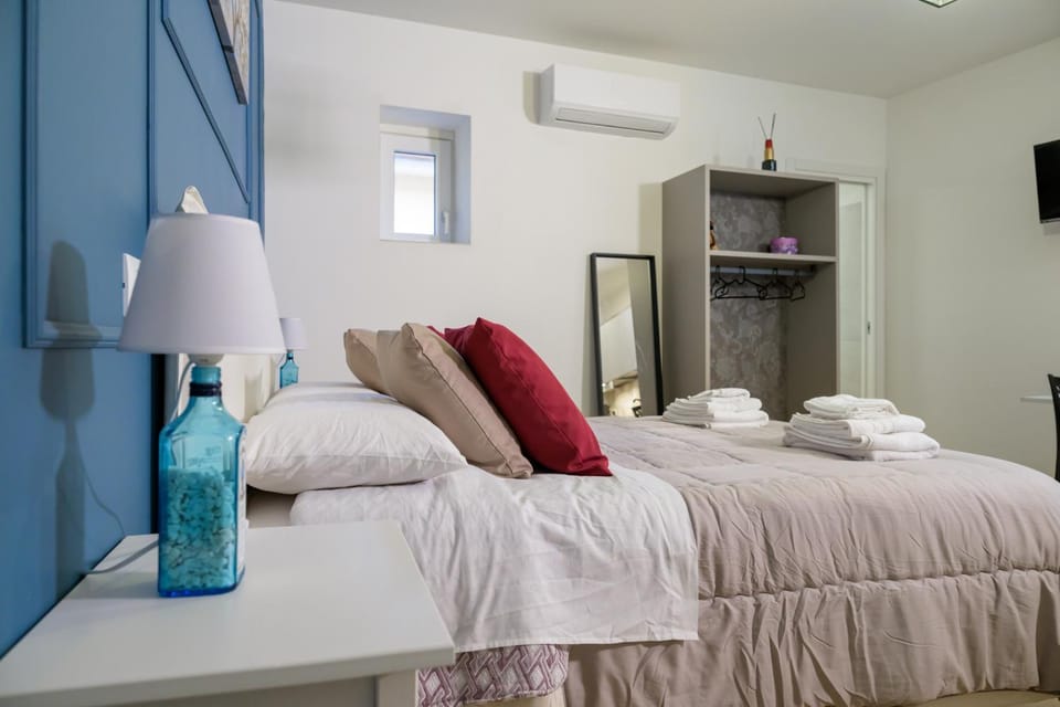Bed, towels, wardrobe